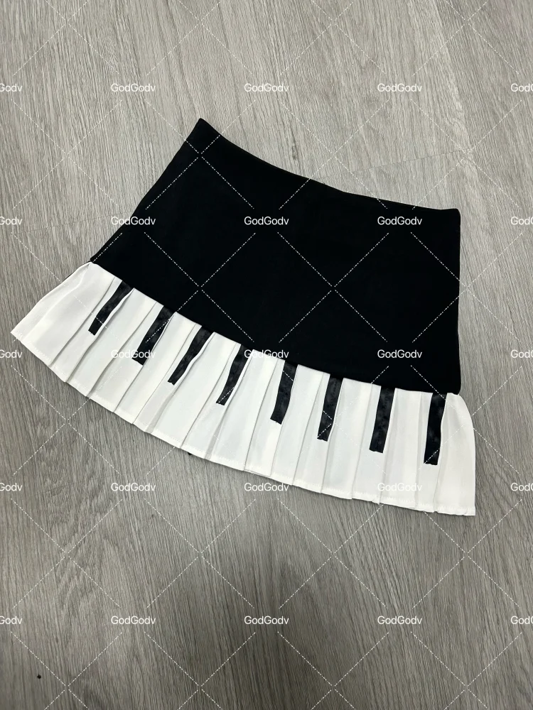 Saia curta feminina primavera preto e branco emendada 2025 Y2K design fino Harajuku mini saia feminina estilo império coreano chique saia piano