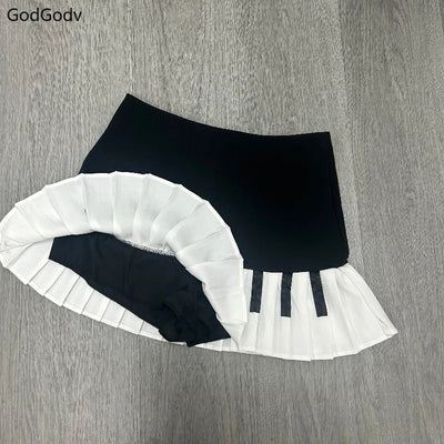 Saia curta feminina primavera preto e branco emendada 2025 Y2K design fino Harajuku mini saia feminina estilo império coreano chique saia piano
