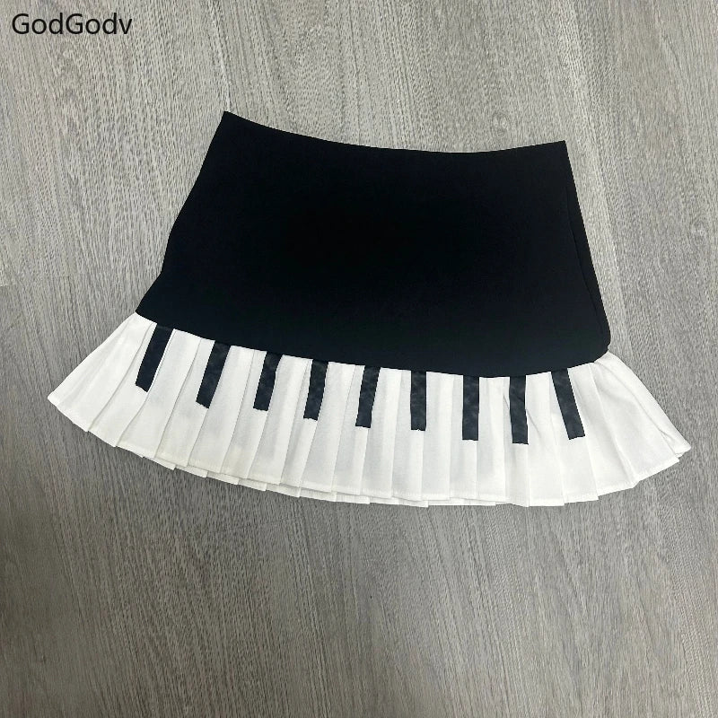 Saia curta feminina primavera preto e branco emendada 2025 Y2K design fino Harajuku mini saia feminina estilo império coreano chique saia piano