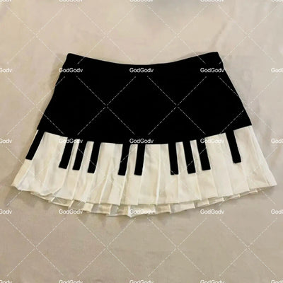 Saia curta feminina primavera preto e branco emendada 2025 Y2K design fino Harajuku mini saia feminina estilo império coreano chique saia piano