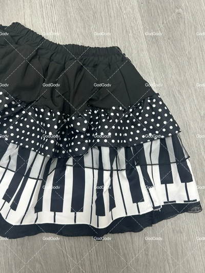 Saia curta feminina primavera preto e branco emendada 2025 Y2K design fino Harajuku mini saia feminina estilo império coreano chique saia piano