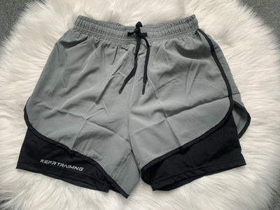 Shorts esportivos casuais anti-exposição de camada dupla masculinos, mais vendidos no verão, para corrida, fitness, calças três quartos